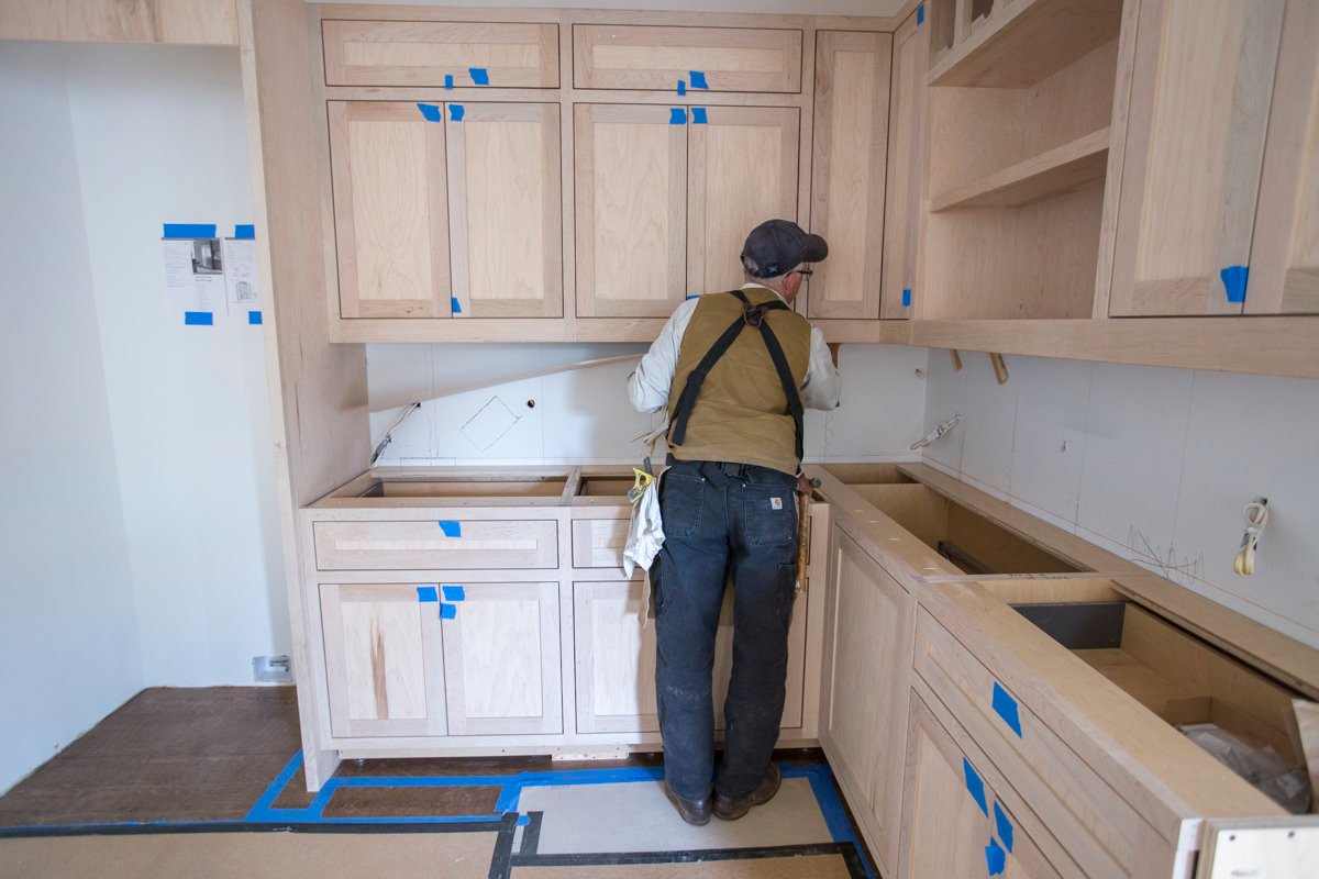 Guy using cabinets